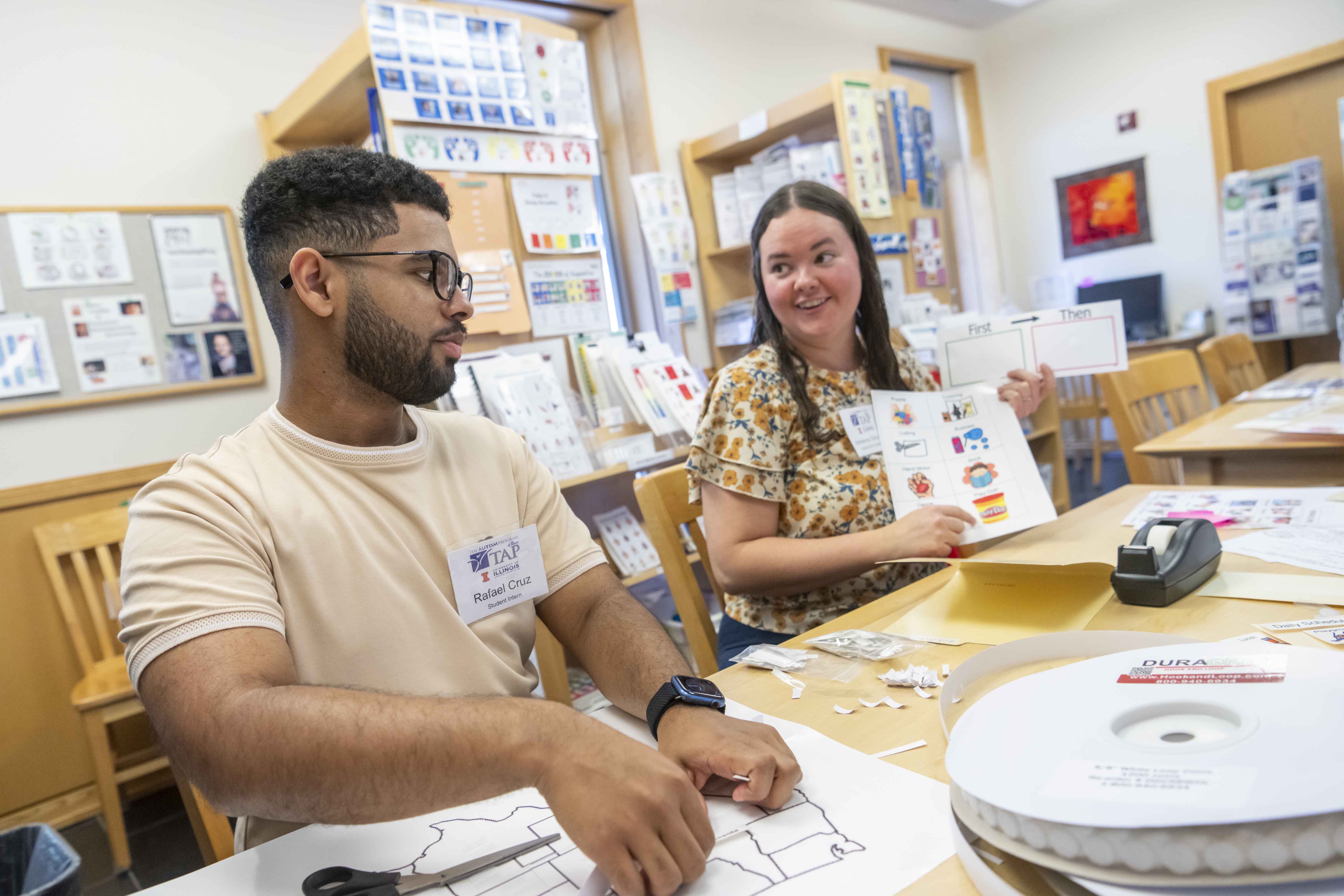 two people working at a table