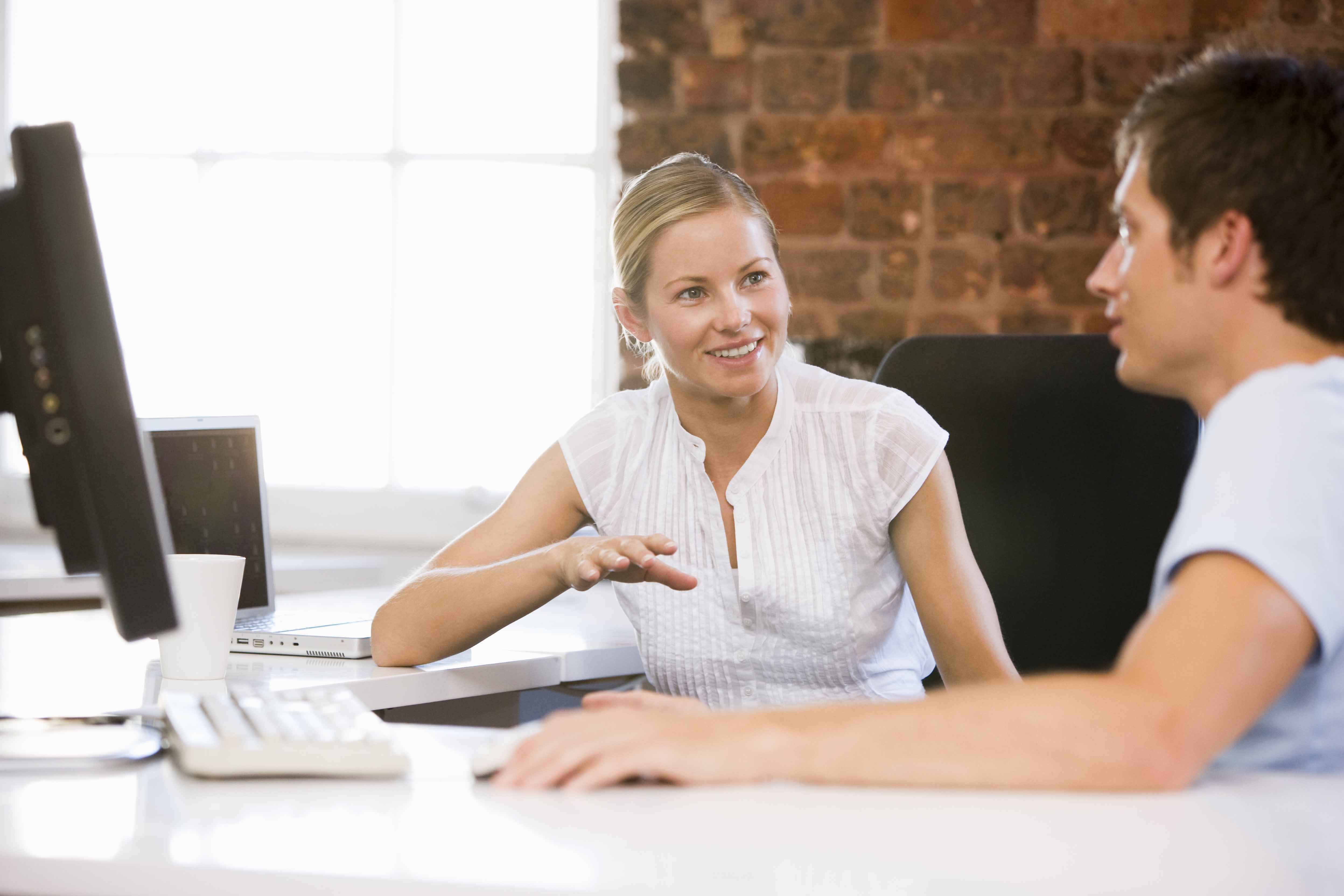 two people talking in office