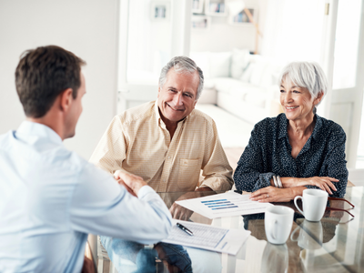 Man and couple meeting, sitting at a table 