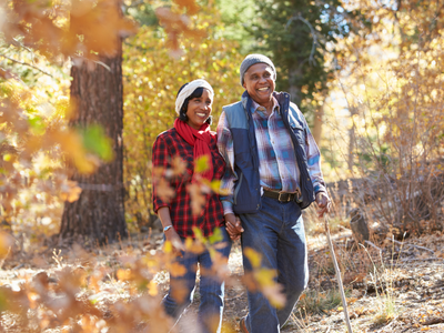 Man and women walking together in the woods